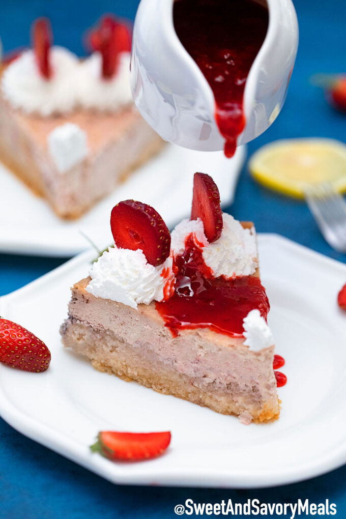 Picture of Keto strawberry cheesecake with strawberry sauce.