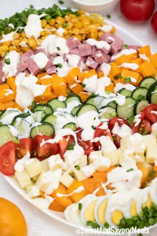 Image of chef salad with blue cheese dressing.