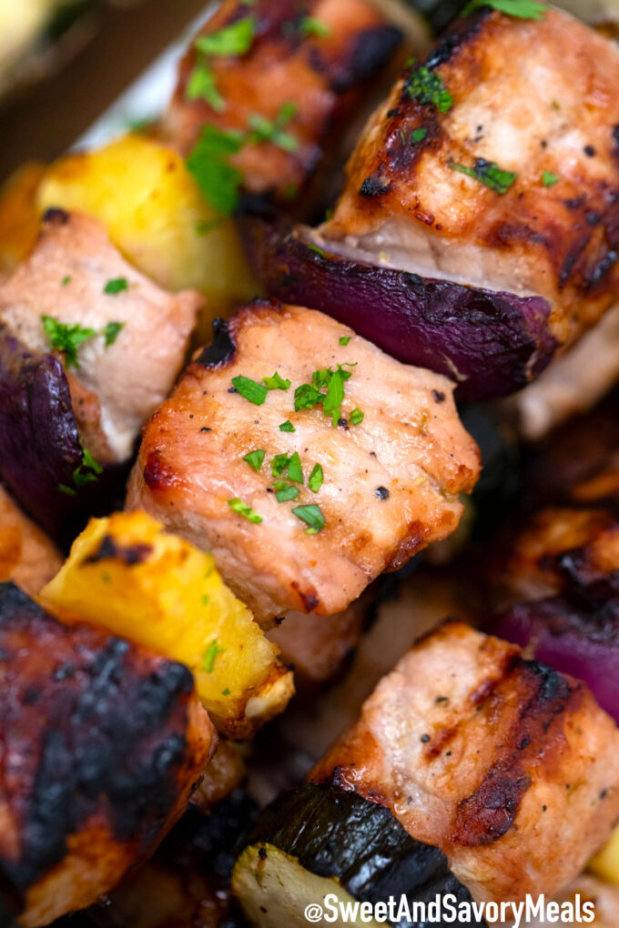 Grilled pork skewers with pineapple and onions.