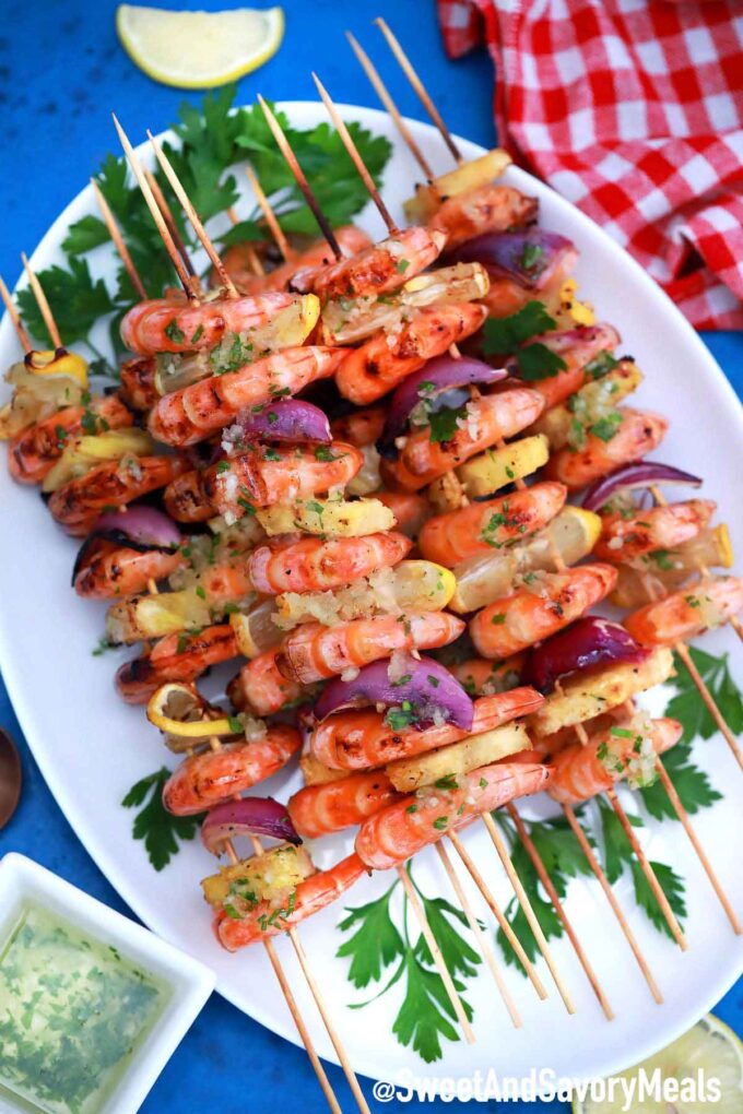 Shrimp kebabs on a white plate