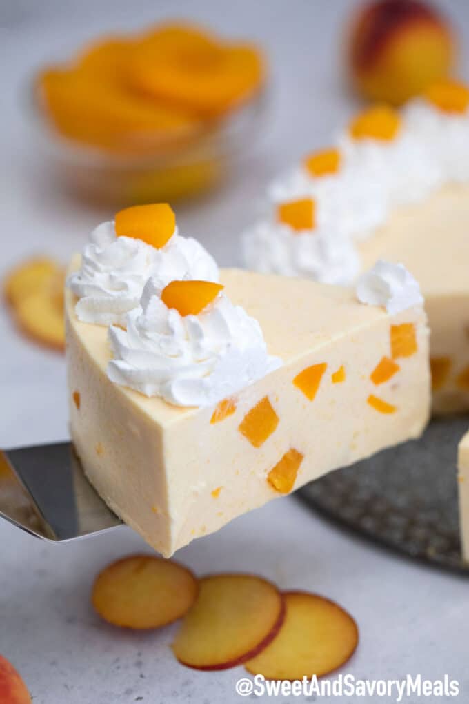 Photo of a slice of no bake peach cheesecake.