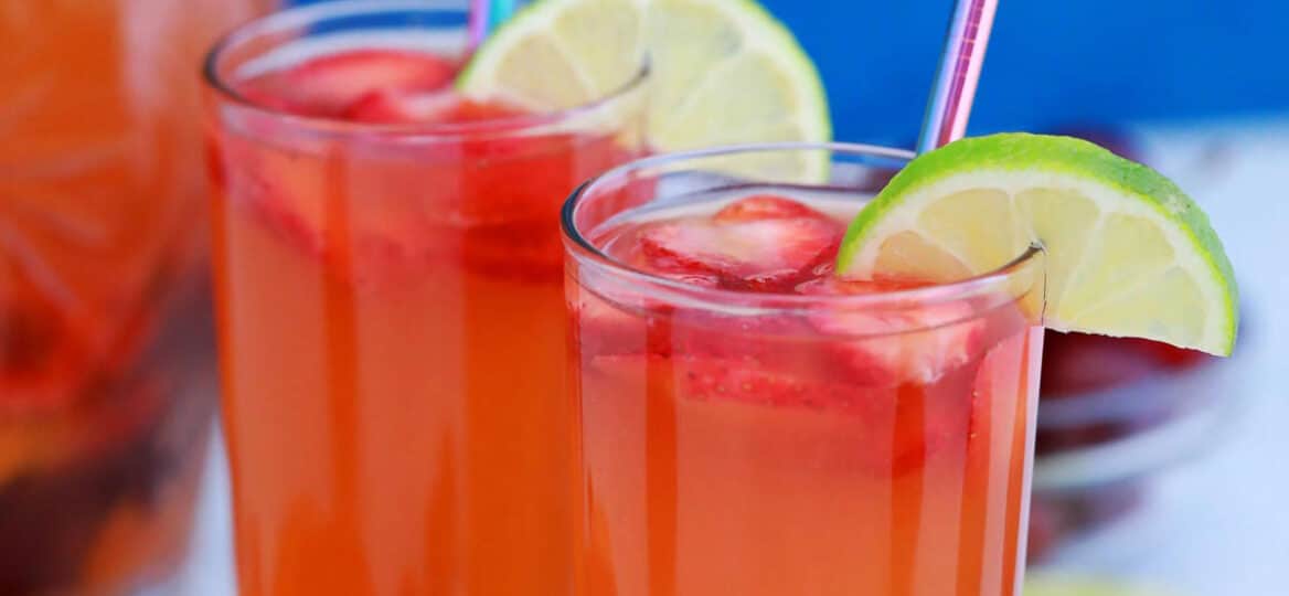 Picture of peach sangria with cherries and strawberries.