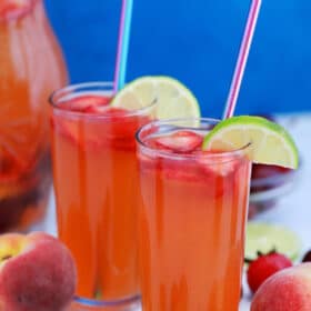 Picture of peach sangria with cherries and strawberries.