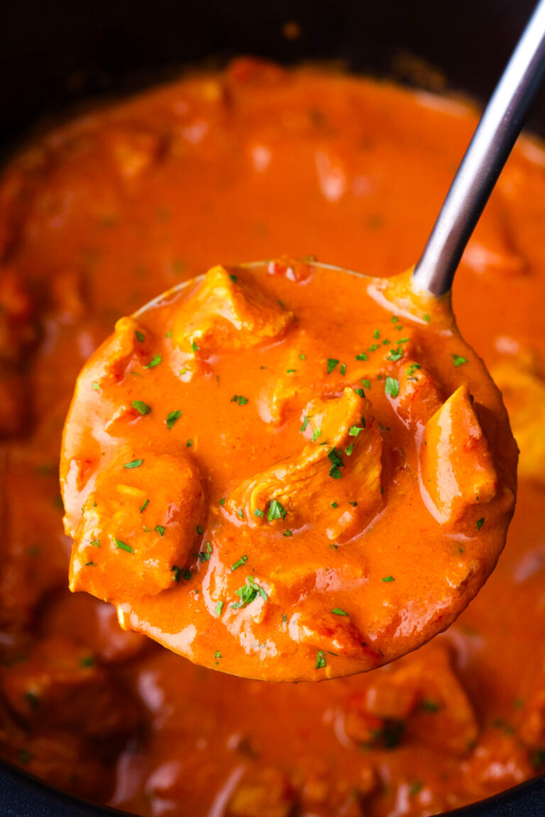 A ladle of creamy slow cooker tikka masala.
