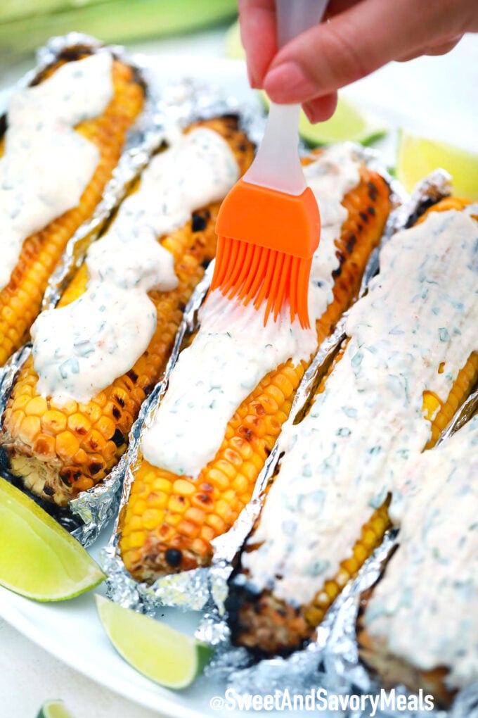 Mexican street corn with creamy topping.