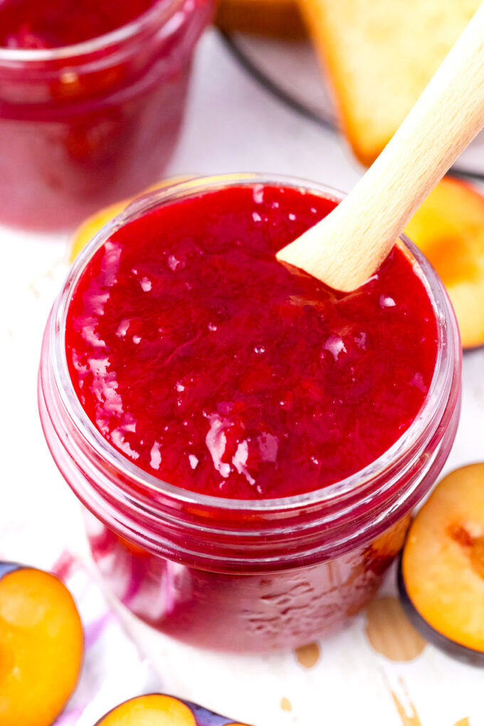 Homemade plum jam in a mason jar.
