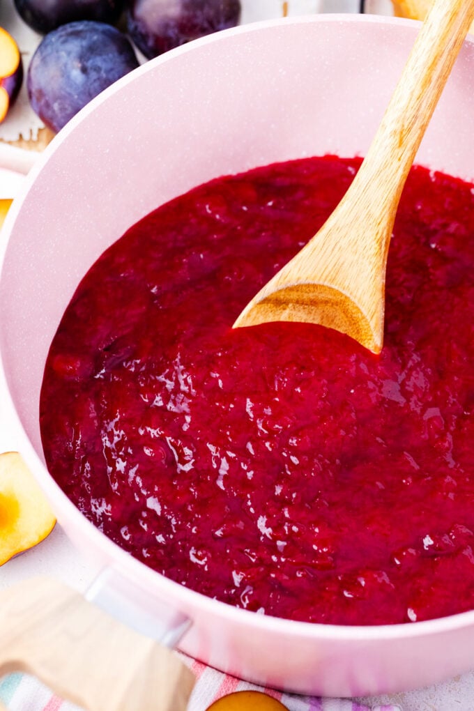 Homemade plum jam in a sauce pan.