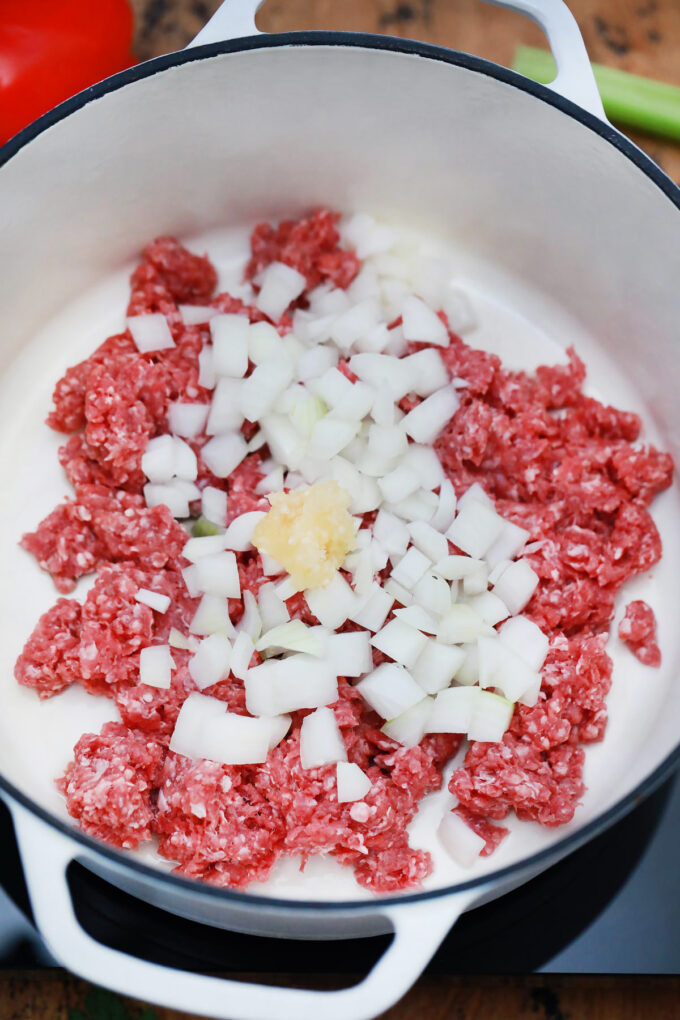 Cooking beed, onion, and garlic.