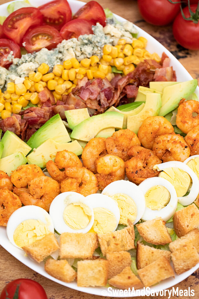 Shrimp Cobb Salad with bacon avocado eggs and blue cheese.