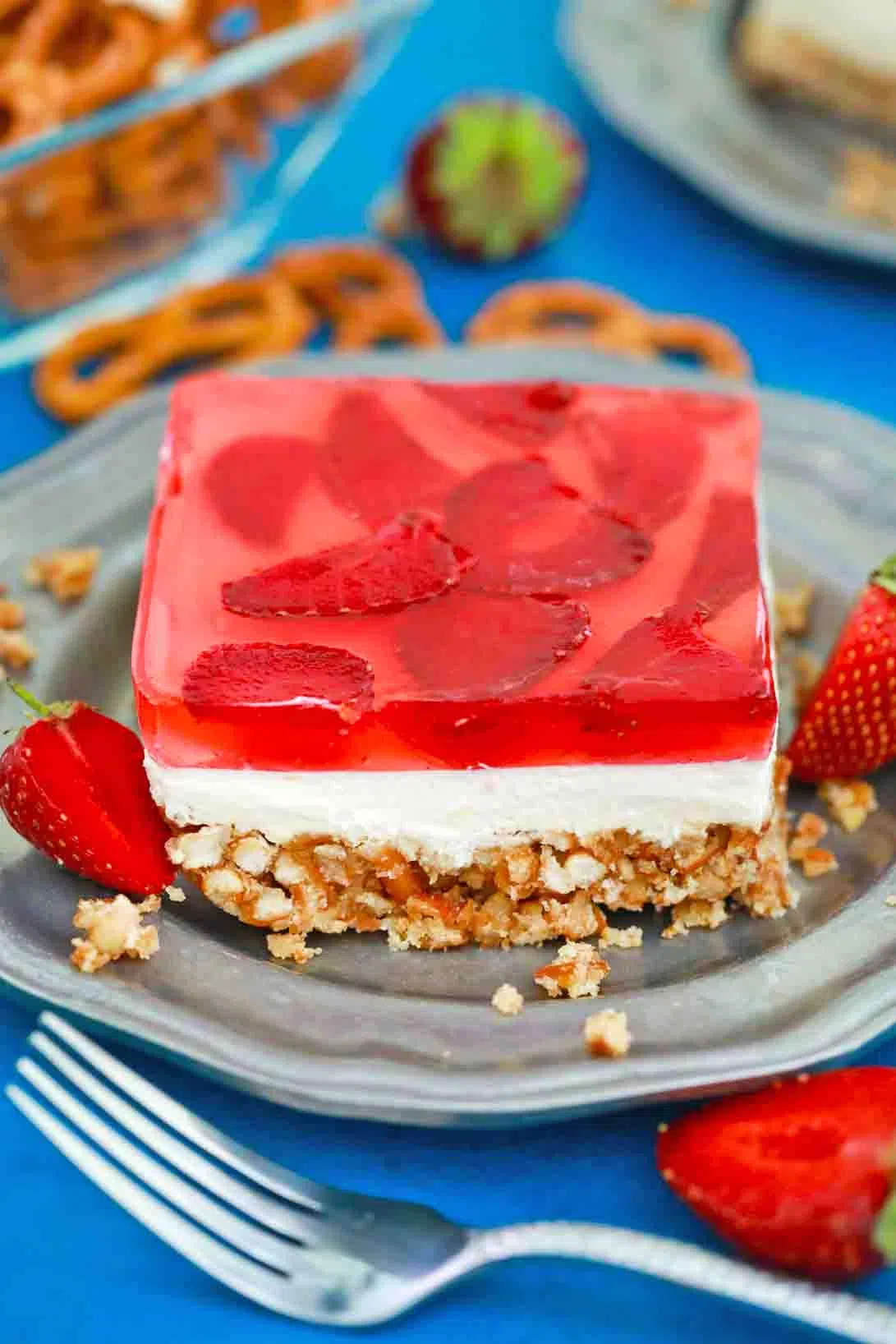 A slice of strawberry pretzel salad recipe on a plate.