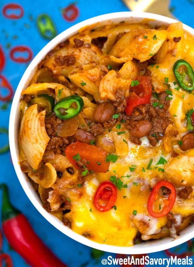 Chili Mac in a bowl topped with jalapeños.