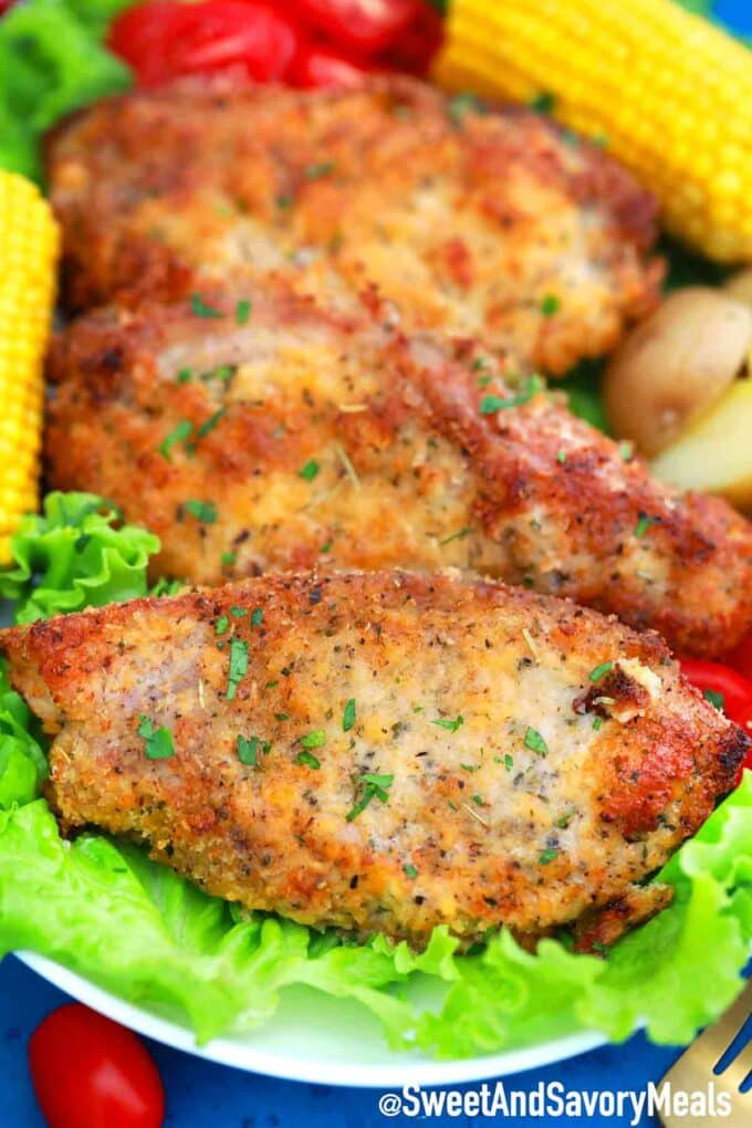 Crispy Pork Chops with greens and corn.