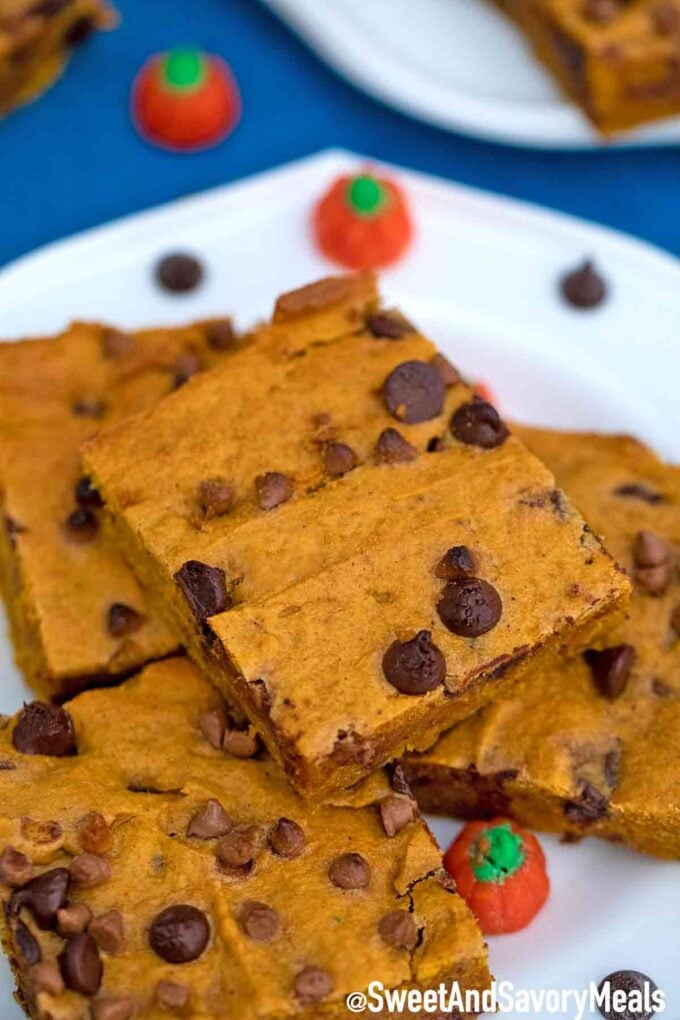 Chocolate chip pumpkin bars stacked on a plate