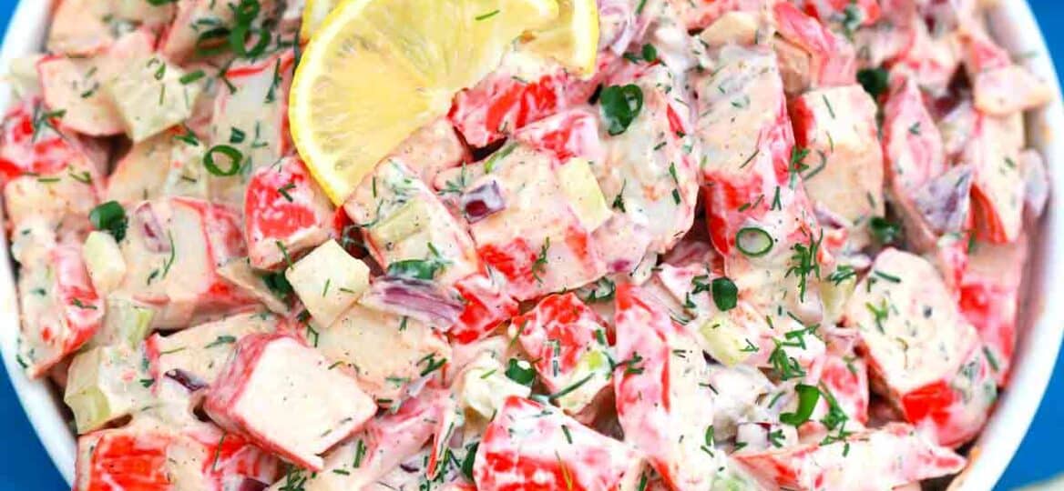 Crab salad topped with lemon slices.