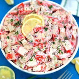 Crab salad topped with lemon slices.