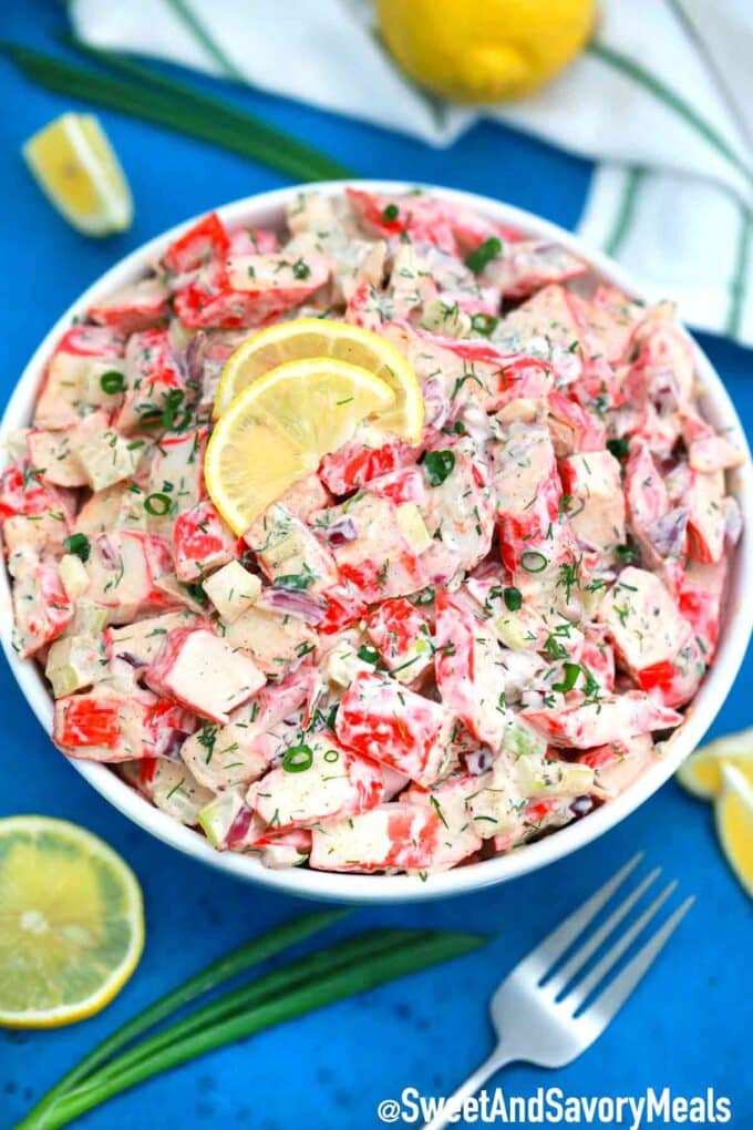 Crab salad topped with lemon slices in a bowl