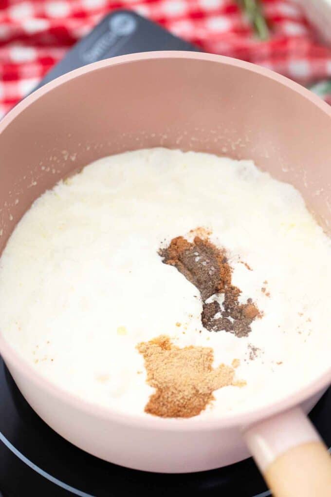 mixing spices into cream in a saucepan