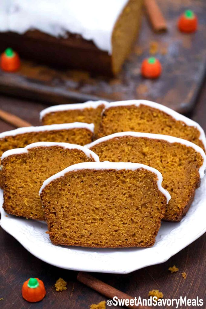 Sliced pumpkin bread on a white plate