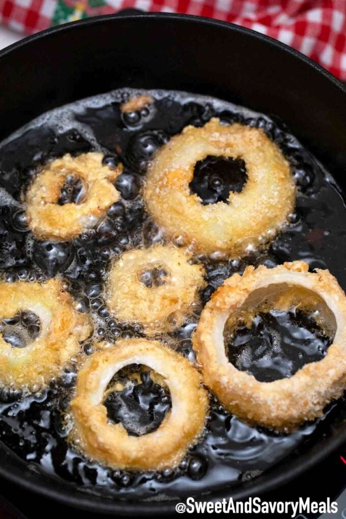 frying onion rings in a skillet