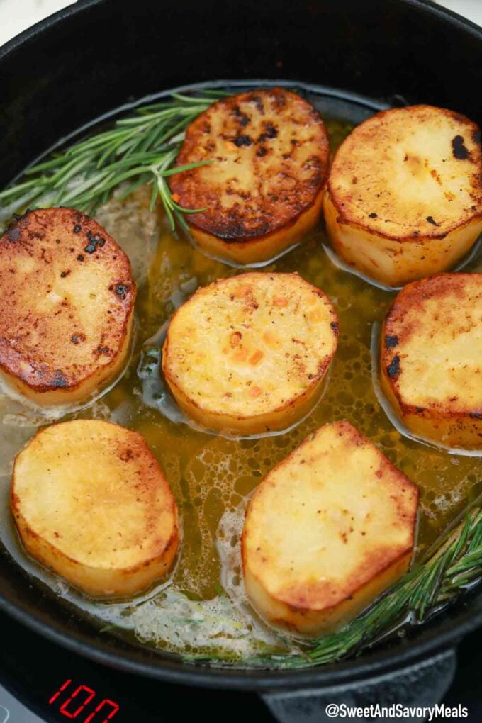 fondant potatoes in a cast iron pan