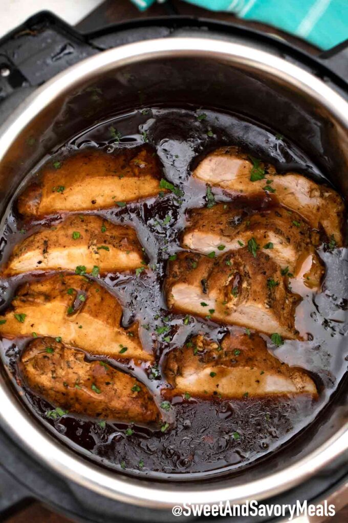 sliced instant pot balsamic pork loin in balsamic sauce in the instant pot