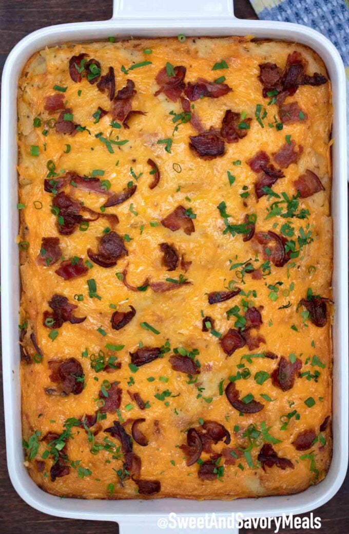 Freshly baked potato casserole topped with bacon and parsley