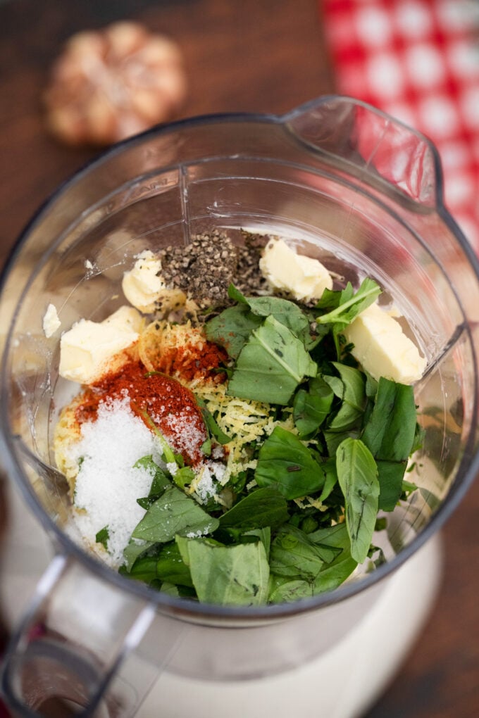 Butter herb mixture ingredients in a food processor.