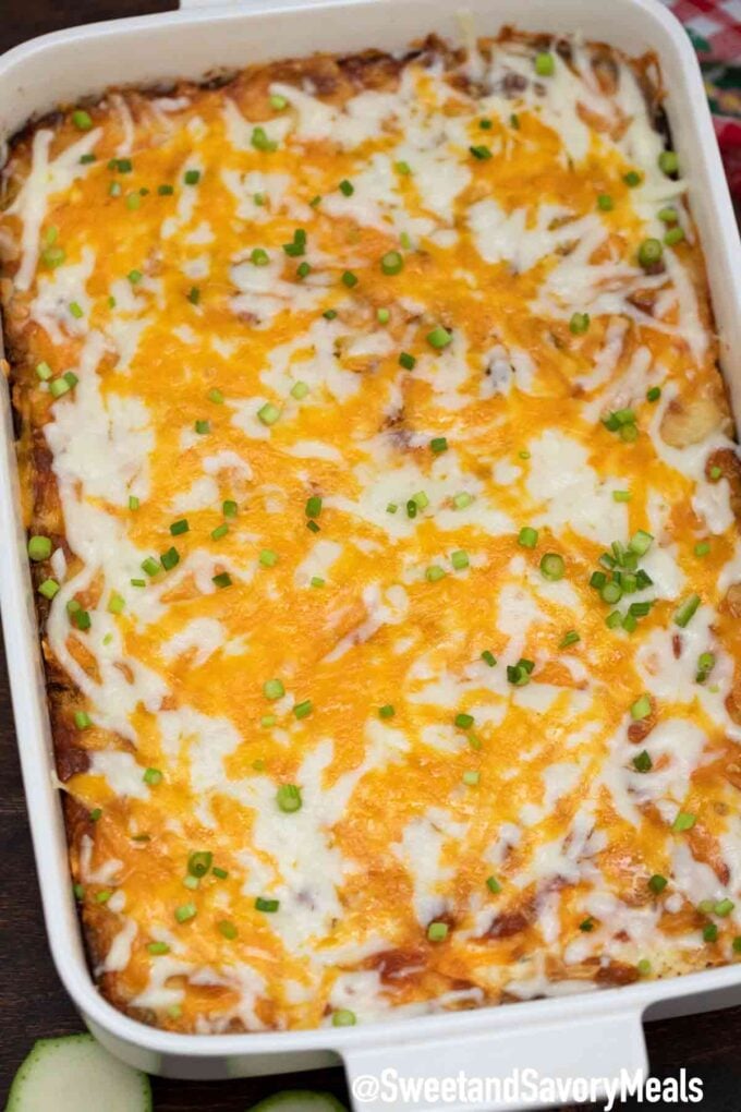 zucchini casserole topped with cheddar cheese