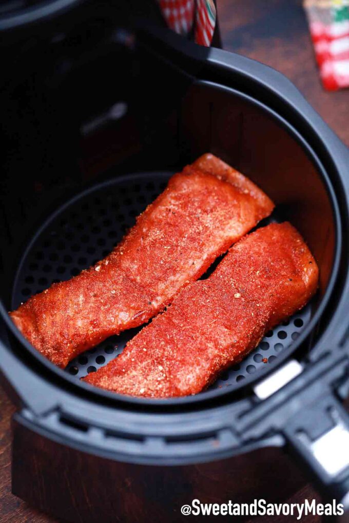 seasoned salmon filets in the air fryer basket