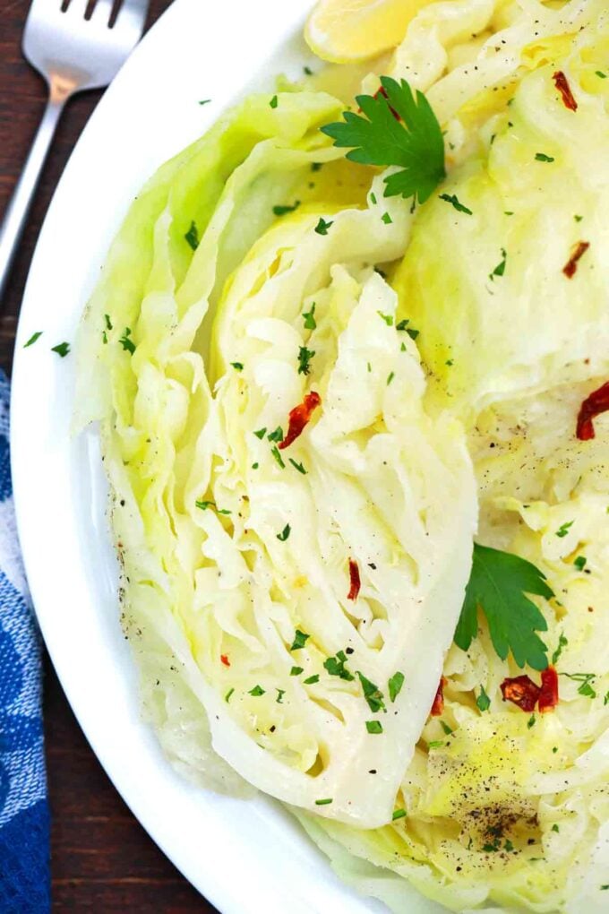 cooked cabbage wedge on a serving plate