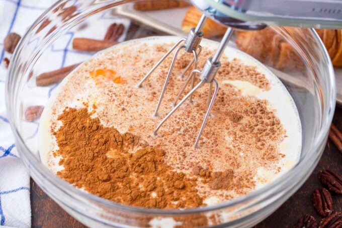 Whisking custard for croissant French toast casserole.