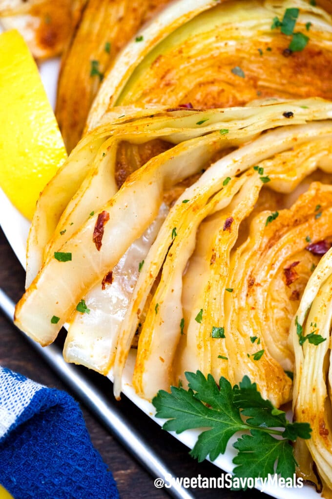 roasted cabbage slices with seasoning and lemon