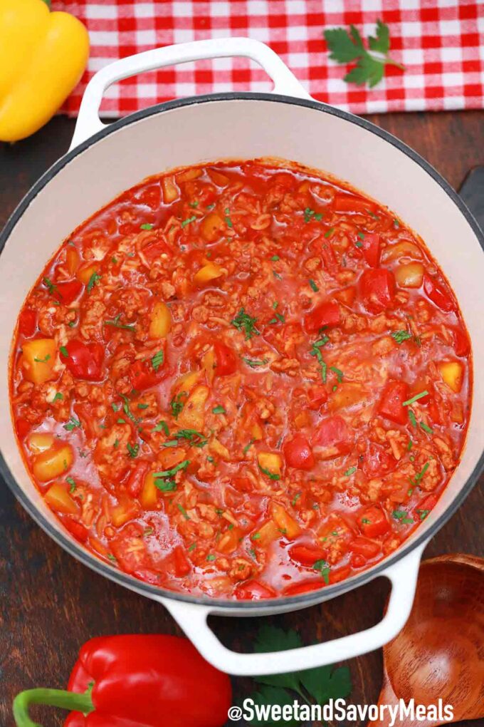 a pot of unstuffed peppers with bell peppers next to it