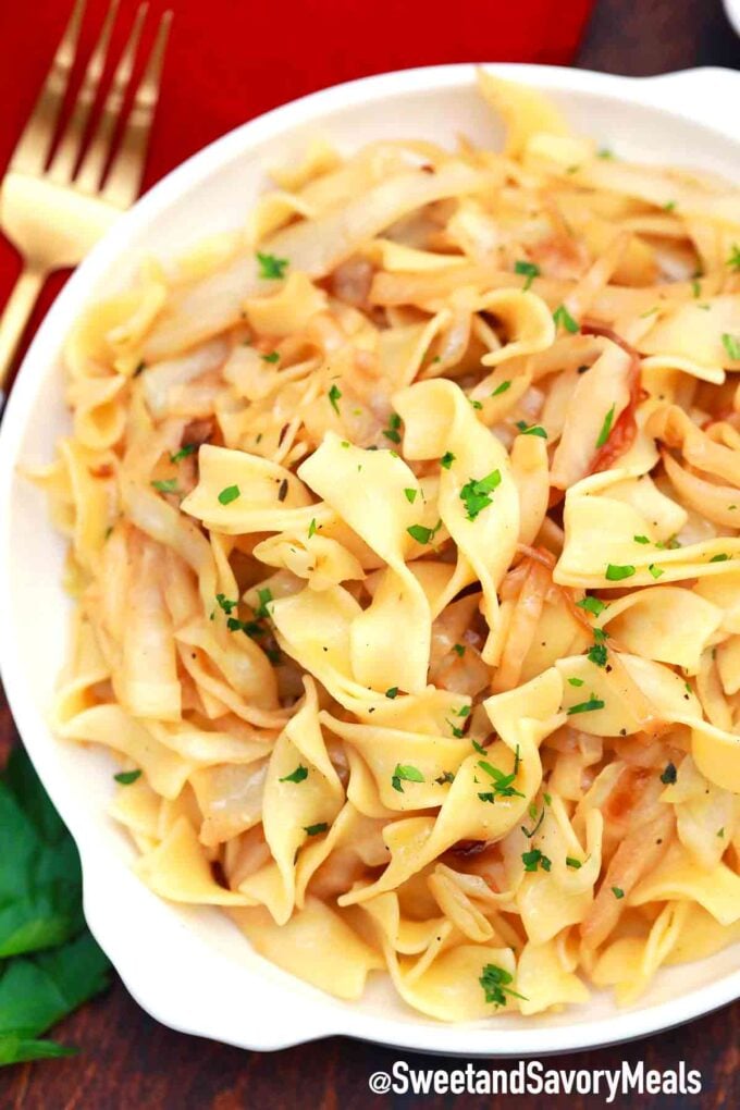 a plate of fried cabbage and noodles