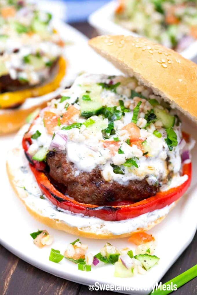 Juicy grilled Greek lamb burger on a bun