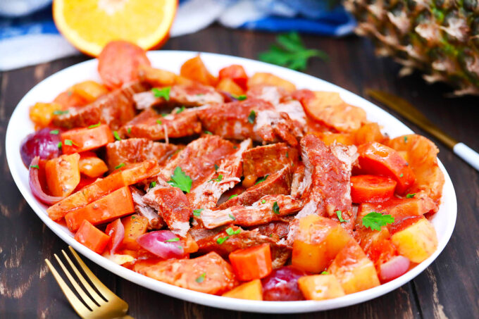 Shredded slow cooker Caribbean pot roast with pineapple and root vegetables.