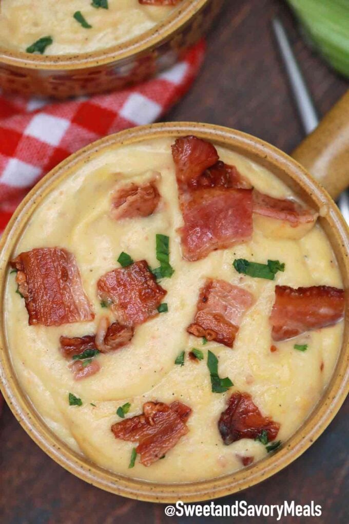 potato and cabbage soup with bacon in bowls