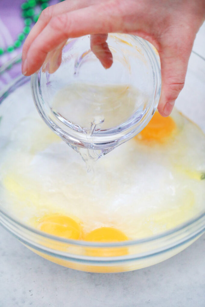 Preparing cake mix according to package directions.