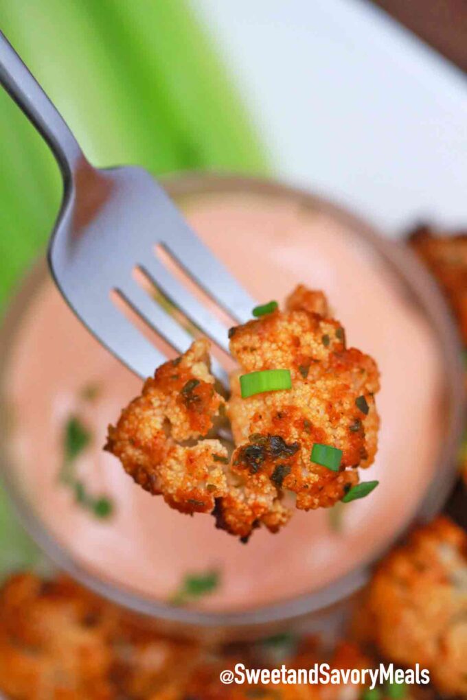 air fryer buffalo cauliflower wings on a fork