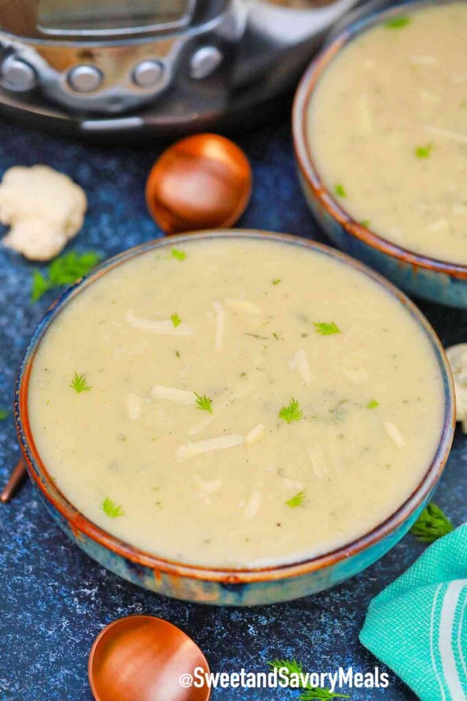 creamy cauliflower soup with cheese in a bowl