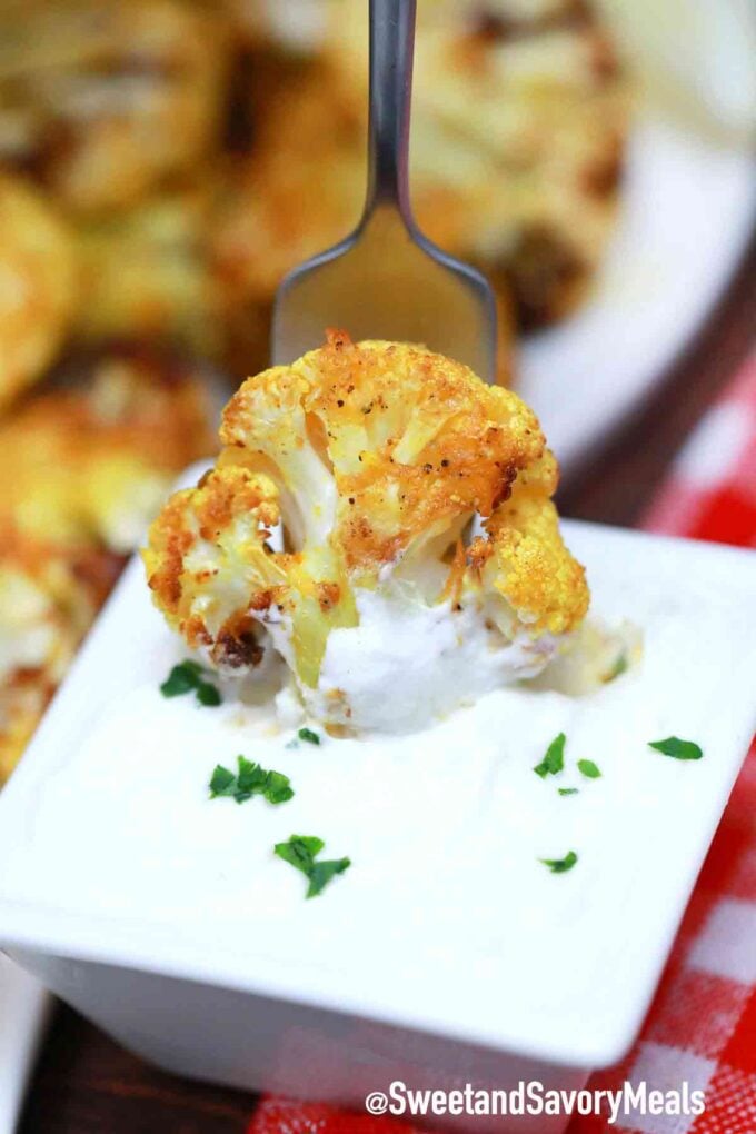 roasted cauliflower dipped in white sauce
