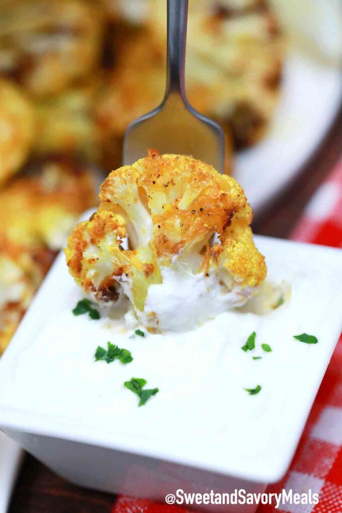 roasted cauliflower dipped in white sauce