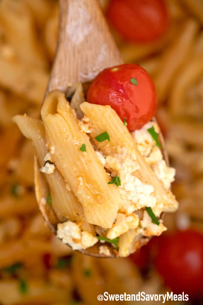 instant pot feta pasta on a wooden spoon