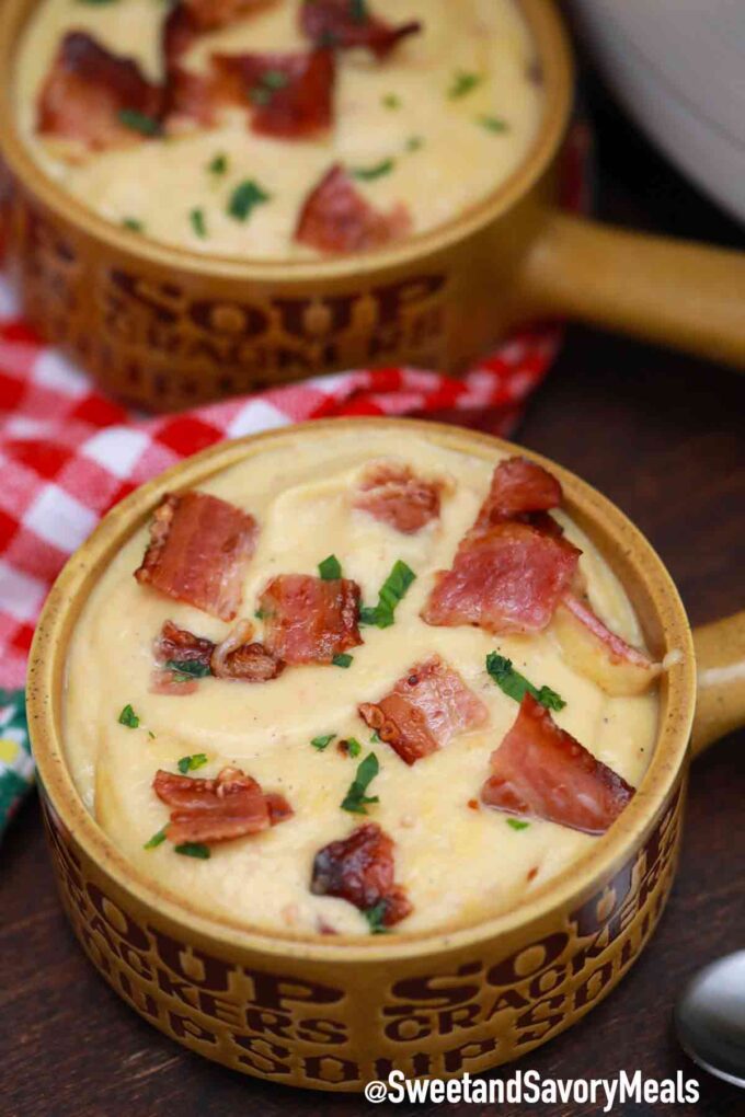 potato and cabbage soup with bacon in bowls