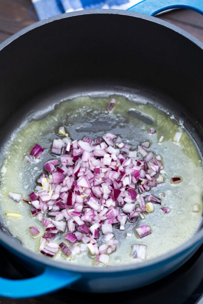 Sauteing red onion in butter.