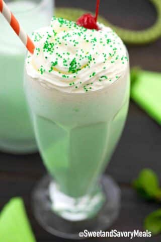 shamrock shake with whipped cream and a maraschino cherry