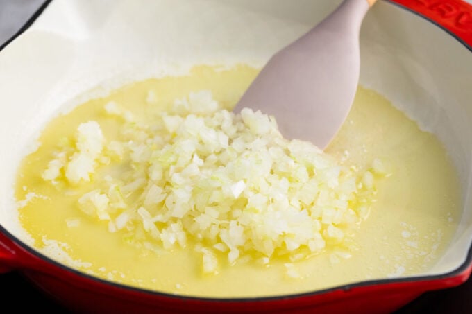 Sauteing onion and garlic in butter.