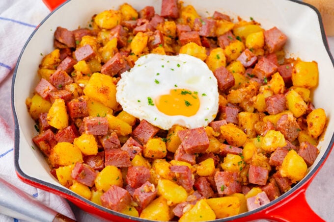 Corned beef hash topped with a runny egg.
