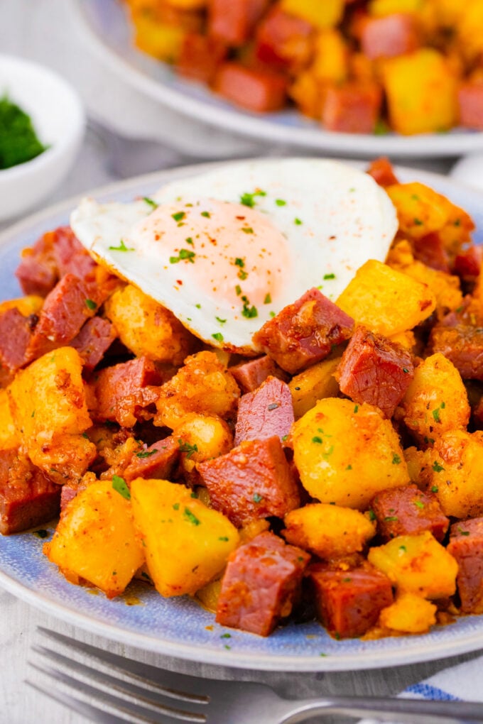 Crispy corned beef hash served with an egg.