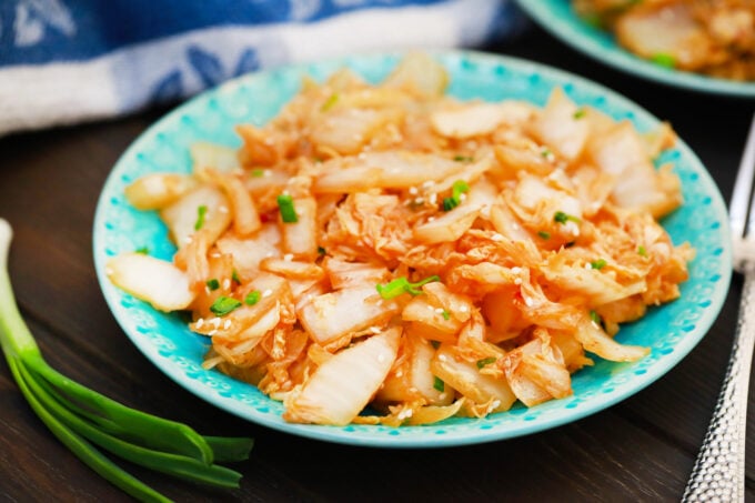 Serving sauteed Napa cabbage topped with green onions and sesame seeds.
